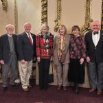 Standing, from left to right, RMHC Board President Dan Miller, Founders John Myers, Garry Finkell, Barbara Hoehn, Kathy Schoolcraft, Debbie Ross, and Dr. Bill Cromie, and CEO Kimmy Venter