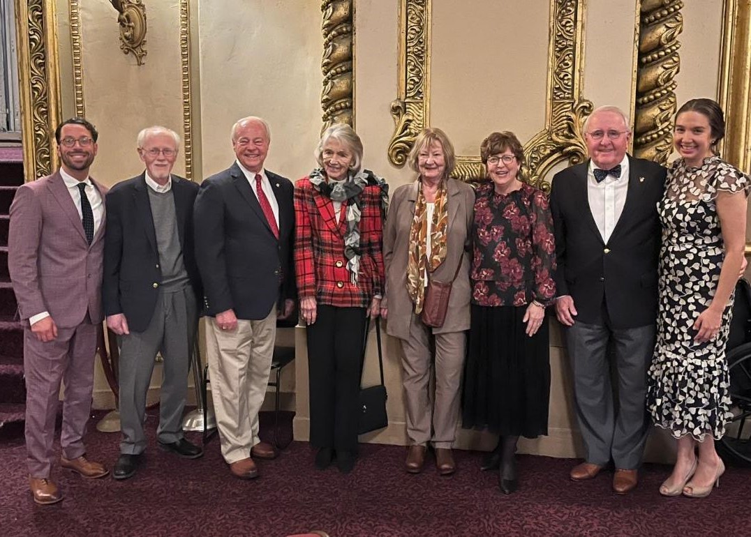 Standing, from left to right, RMHC Board President Dan Miller, Founders John Myers, Garry Finkell, Barbara Hoehn, Kathy Schoolcraft, Debbie Ross, and Dr. Bill Cromie, and CEO Kimmy Venter