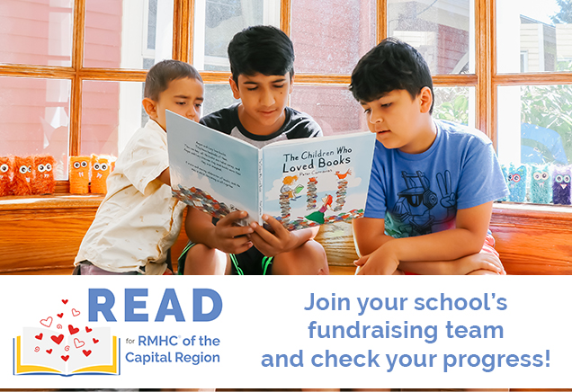 Three boys reading a book together in front of a large, bright window. Banner across image with READ for RMHC logo and text: Join your school's fundraising team and check your progress!
