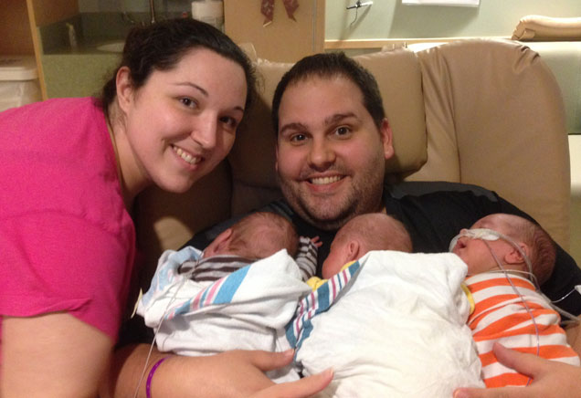 Parents with newborn triplets